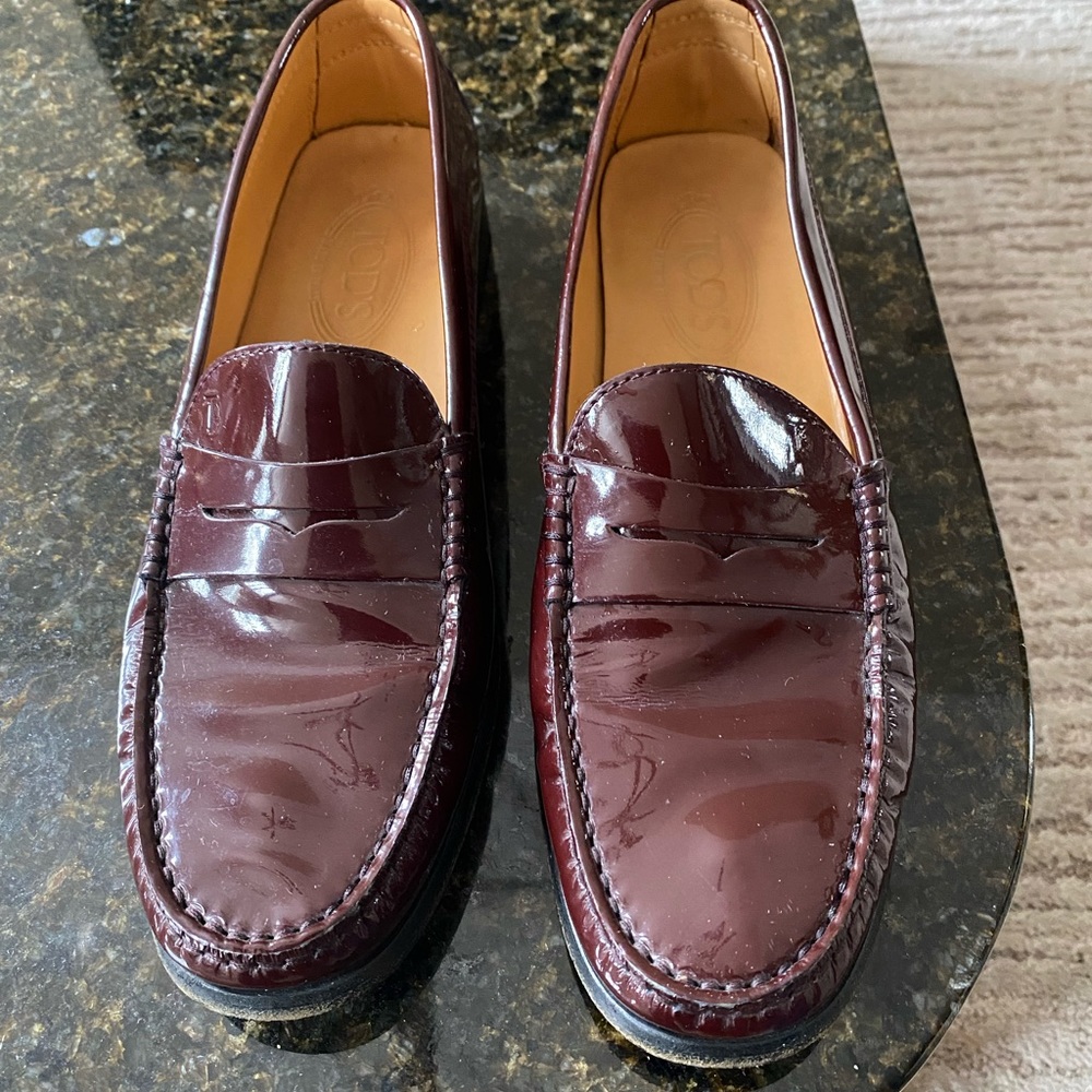 Tod’s.  Made in Italy patent leather shoes